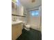 Charming bathroom with tiled walls, featuring a sink, toilet, and shower-tub combo, under bright lighting at 3530 Beechwood N Ter, Pinellas Park, FL 33781