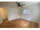 Bright bedroom featuring hardwood floors, a ceiling fan, and natural light at 3530 Beechwood N Ter, Pinellas Park, FL 33781