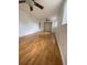 Bright bedroom featuring laminate flooring, ceiling fans, and ample space, ideal for relaxation at 3530 Beechwood N Ter, Pinellas Park, FL 33781