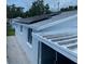 This exterior features a well-maintained roof, white siding, and possibly solar panels for energy efficiency at 3530 Beechwood N Ter, Pinellas Park, FL 33781