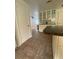 Open kitchen area featuring classic cabinetry and view into a living space with hardwood floors at 3530 Beechwood N Ter, Pinellas Park, FL 33781
