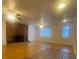Large living room featuring a brick fireplace and beautiful hardwood flooring at 3530 Beechwood N Ter, Pinellas Park, FL 33781