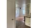 View into a living room featuring hardwood floors, ceiling fan, and natural light from window with blinds at 3530 Beechwood N Ter, Pinellas Park, FL 33781