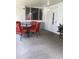 A covered patio features an outdoor seating area with a table and chairs, creating a cozy space at 3530 Beechwood N Ter, Pinellas Park, FL 33781