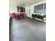 Inviting covered patio featuring a table, chairs, and potted plants creating an attractive outdoor area at 3530 Beechwood N Ter, Pinellas Park, FL 33781