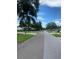 Picturesque street view featuring mature trees and well-maintained landscaping at 3530 Beechwood N Ter, Pinellas Park, FL 33781