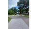 A street view showcasing the mature trees and quiet setting of the neighborhood at 3530 Beechwood N Ter, Pinellas Park, FL 33781