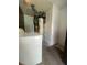 A utility room equipped with a water heater and a modern washing machine at 3530 Beechwood N Ter, Pinellas Park, FL 33781