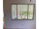 Window with closed blinds and a view of a tree at 3530 Beechwood N Ter, Pinellas Park, FL 33781