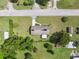 Overhead shot of the property showing the house layout, lawn, and surrounding mature trees at 37722 Granada Ave, Dade City, FL 33525