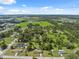 Beautiful aerial shot of the property surrounded by green fields, trees, and a vast landscape at 37722 Granada Ave, Dade City, FL 33525