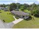 Aerial shot of a home featuring a long driveway, large yard, and covered parking at 37722 Granada Ave, Dade City, FL 33525