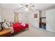 Bright bedroom with ceiling fan, desk and large windows at 37722 Granada Ave, Dade City, FL 33525