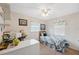Cozy bedroom with a ceiling fan, bright windows, and charming decor creating a welcoming atmosphere at 37722 Granada Ave, Dade City, FL 33525