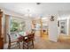 Dining area adjacent to the kitchen, featuring access to the outdoor patio at 37722 Granada Ave, Dade City, FL 33525