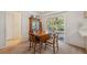Cozy dining area with a wooden table, chairs, and sliding glass doors to the patio at 37722 Granada Ave, Dade City, FL 33525