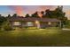 Charming single-story home featuring a brick facade and well-maintained landscaping at 37722 Granada Ave, Dade City, FL 33525