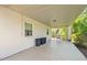 Covered patio area, perfect for outdoor dining and entertaining, with a view of the backyard at 37722 Granada Ave, Dade City, FL 33525