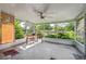 Relaxing screened-in porch offers a serene outdoor space with comfortable seating and views of the lush backyard at 37722 Granada Ave, Dade City, FL 33525