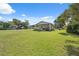 Spacious lawn and shady trees surround the home, offering a tranquil setting at 37722 Granada Ave, Dade City, FL 33525