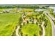 Aerial view of community ball field, playground and park with covered picnic tables within a Gathering-friendly environment at 3897 Villamore Ln, Odessa, FL 33556