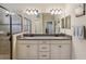 Bright bathroom features a double sink vanity and spacious walk-in shower at 3897 Villamore Ln, Odessa, FL 33556