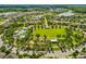 Aerial view of community park offering a pool, picnic areas and green spaces fostering an active and social neighborhood at 3897 Villamore Ln, Odessa, FL 33556