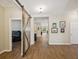 Hallway with wood look floors that leads to other rooms in the home at 3897 Villamore Ln, Odessa, FL 33556