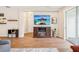 Comfortable living room with tile flooring, decorative shelves, and an electric fireplace at 3897 Villamore Ln, Odessa, FL 33556