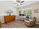 Comfortable home office with a neutral color palette, wood flooring, and ample natural light at 3897 Villamore Ln, Odessa, FL 33556
