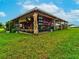 Open-air market structure with plants for sale and wooden support beams at 3897 Villamore Ln, Odessa, FL 33556