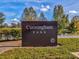 Cunningham Park sign surrounded by lush greenery and trees, inviting visitors to explore nature at 3897 Villamore Ln, Odessa, FL 33556