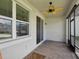 An outdoor patio with brick flooring, a ceiling fan, and sliding glass doors at 3897 Villamore Ln, Odessa, FL 33556