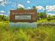 Community Welcome Center featuring new home and community information with lush landscaping at 3897 Villamore Ln, Odessa, FL 33556