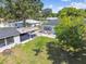 Aerial view of a home, detached garage, and well maintained lawn at 4007 S Renellie Dr, Tampa, FL 33611