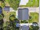 The house features a backyard with a patio and mature trees and is fenced in at 4007 S Renellie Dr, Tampa, FL 33611