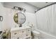 White bathroom featuring a modern vanity, large mirror, and shower/tub combination at 4007 S Renellie Dr, Tampa, FL 33611