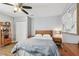 Bedroom featuring wood floors, wooden furniture and ample lighting at 4007 S Renellie Dr, Tampa, FL 33611