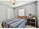 Bright bedroom featuring light gray walls, natural light, and closet at 4007 S Renellie Dr, Tampa, FL 33611