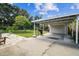 Spacious carport featuring a covered area and large backyard, perfect for parking and outdoor activities at 4007 S Renellie Dr, Tampa, FL 33611