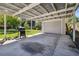 Spacious carport with covered area and outdoor grill, ideal for parking and barbecues at 4007 S Renellie Dr, Tampa, FL 33611