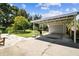 Spacious carport featuring a covered area and large backyard, perfect for parking and outdoor activities at 4007 S Renellie Dr, Tampa, FL 33611