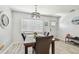 Bright dining area with large window, marble table, and comfortable seating at 4007 S Renellie Dr, Tampa, FL 33611