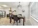 Charming dining area with elegant light fixture, seating for four, and bright natural light at 4007 S Renellie Dr, Tampa, FL 33611