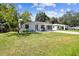 A charming single-story home with a well-manicured lawn and a long, paved driveway at 4007 S Renellie Dr, Tampa, FL 33611
