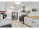 Bright kitchen showcasing stainless steel appliances, white cabinets, and modern design at 4007 S Renellie Dr, Tampa, FL 33611
