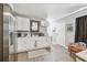 Spacious kitchen featuring white cabinets and stainless steel refrigerator at 4007 S Renellie Dr, Tampa, FL 33611