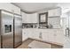Modern kitchen with white cabinets, stainless steel appliances, and stylish countertops at 4007 S Renellie Dr, Tampa, FL 33611