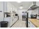 Well-lit kitchen featuring updated cabinets, modern appliances, and stylish backsplash at 4007 S Renellie Dr, Tampa, FL 33611