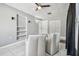 Living room featuring tile floors, white trim, lots of natural light, and built in shelves at 4007 S Renellie Dr, Tampa, FL 33611
